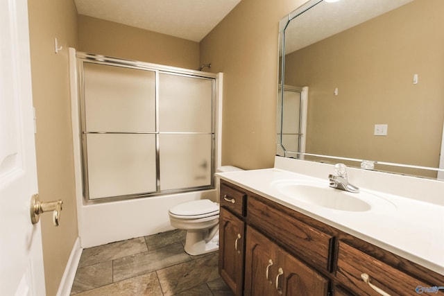 full bathroom with vanity, toilet, and enclosed tub / shower combo