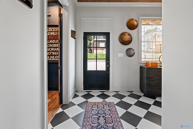 foyer featuring light hardwood / wood-style flooring and crown molding