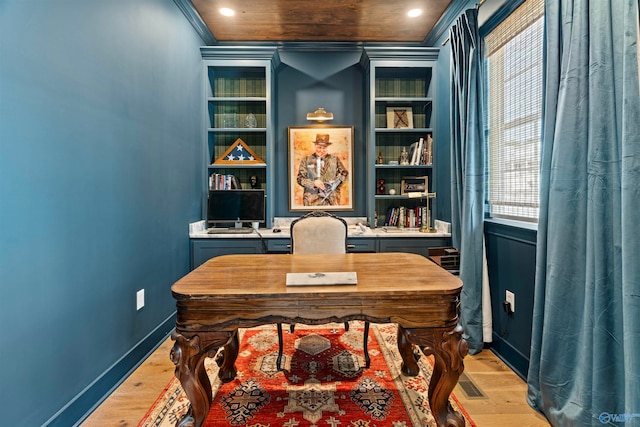 office featuring built in features, crown molding, and light hardwood / wood-style floors