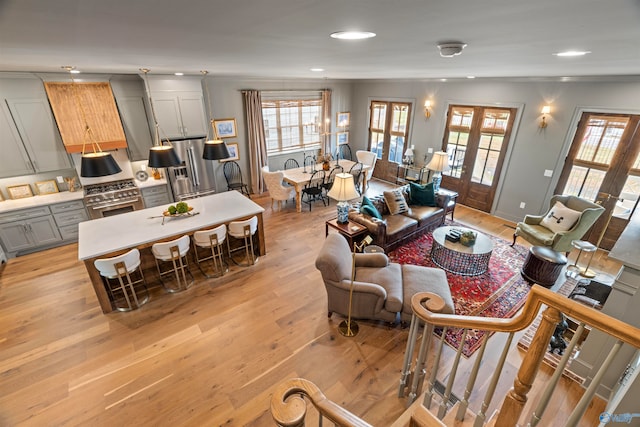 living room featuring light hardwood / wood-style floors and french doors