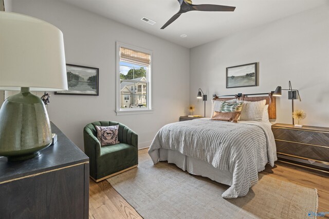 bedroom featuring light hardwood / wood-style floors and ceiling fan