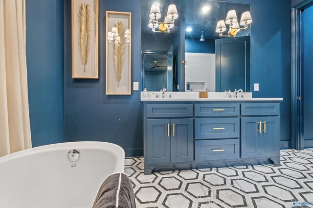 bathroom featuring tile patterned flooring, a washtub, dual vanity, and a chandelier