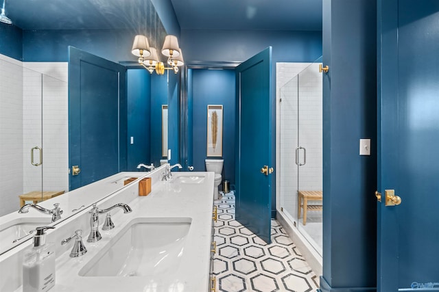 bathroom with toilet, tile patterned floors, walk in shower, and double vanity