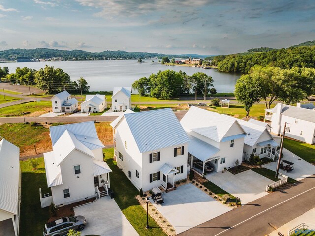 birds eye view of property with a water view