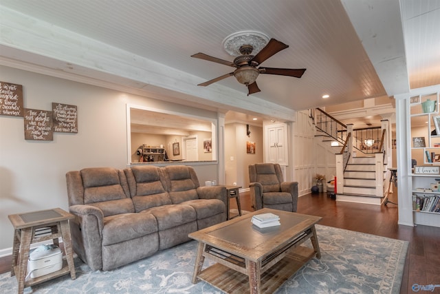 living room with stairs, a ceiling fan, and hardwood / wood-style floors