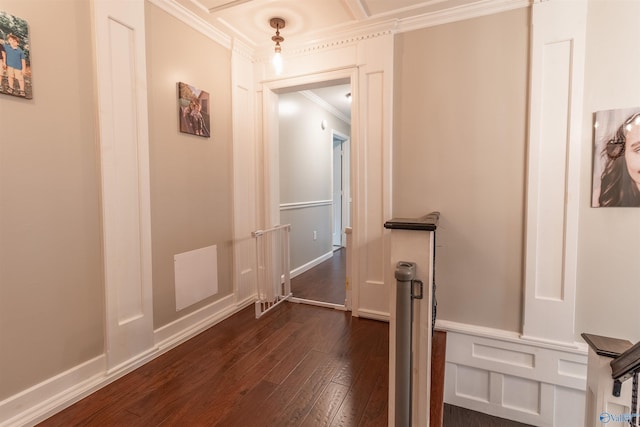 hall featuring dark wood-type flooring, visible vents, and crown molding