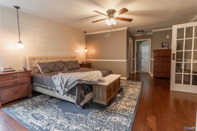 bedroom with baseboards, ceiling fan, dark wood-type flooring, and crown molding