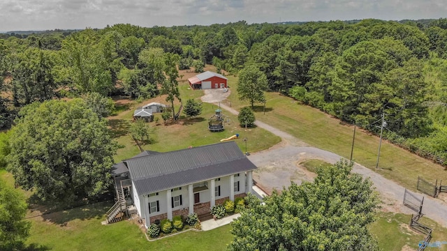 aerial view featuring a wooded view