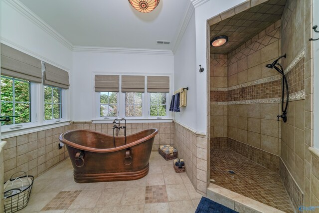 bathroom with crown molding, tile walls, independent shower and bath, and tile patterned floors