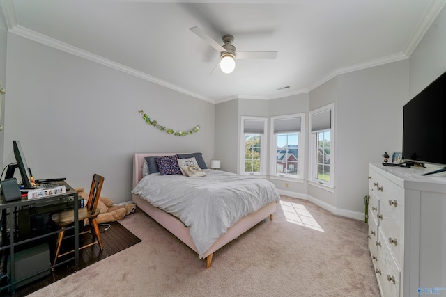 bedroom featuring carpet flooring, ceiling fan, and ornamental molding