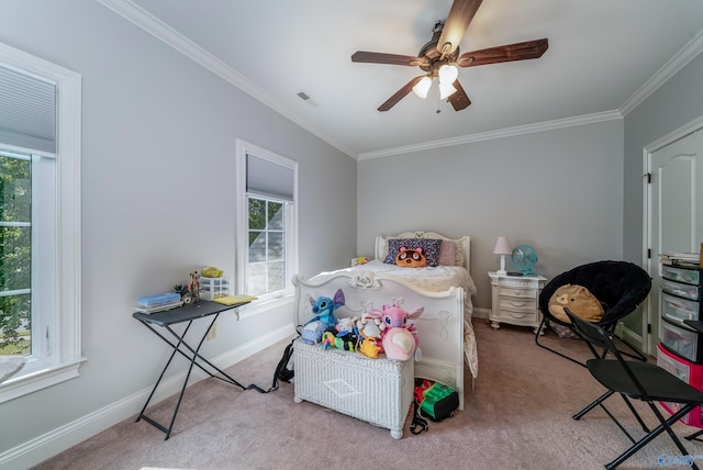 carpeted bedroom featuring ornamental molding and ceiling fan