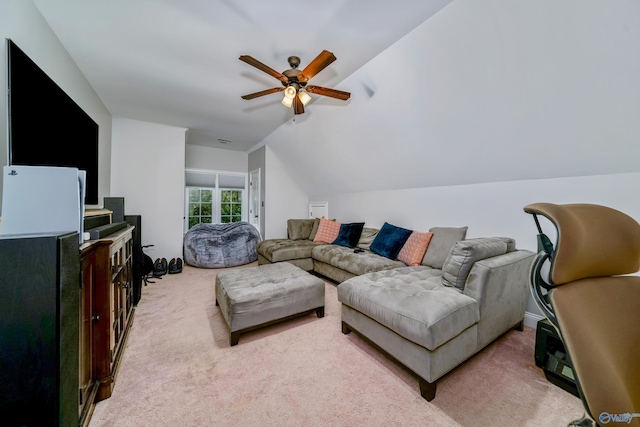 carpeted living room with lofted ceiling and ceiling fan