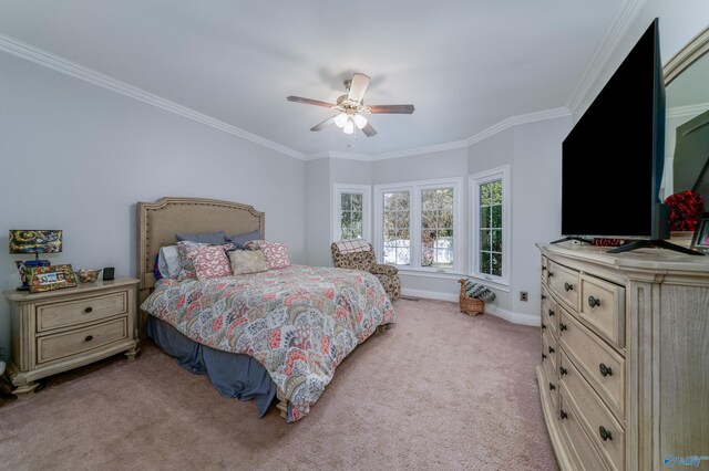 carpeted bedroom featuring ceiling fan and ornamental molding