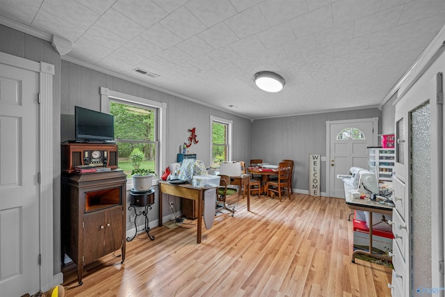 office area featuring visible vents, crown molding, and plenty of natural light
