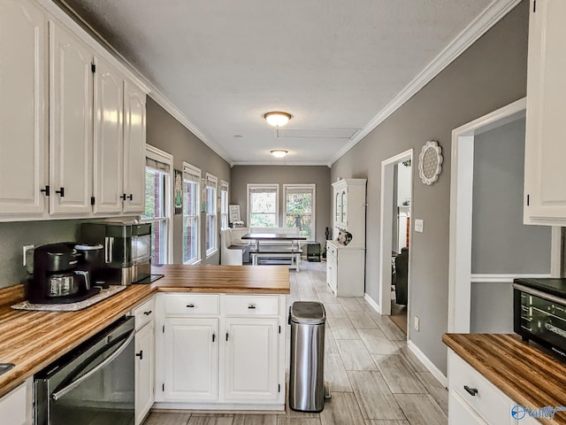 kitchen featuring white cabinets, dishwasher, crown molding, and wooden counters