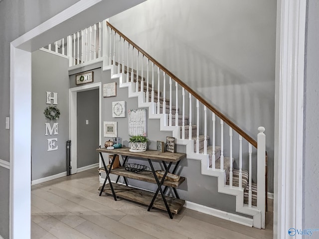 stairs with wood-type flooring