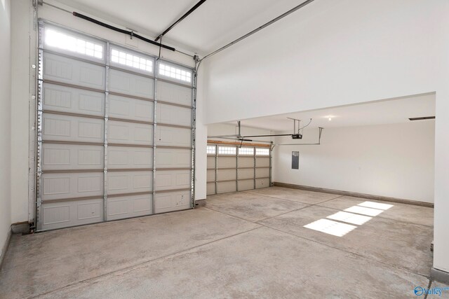 garage featuring baseboards and a garage door opener