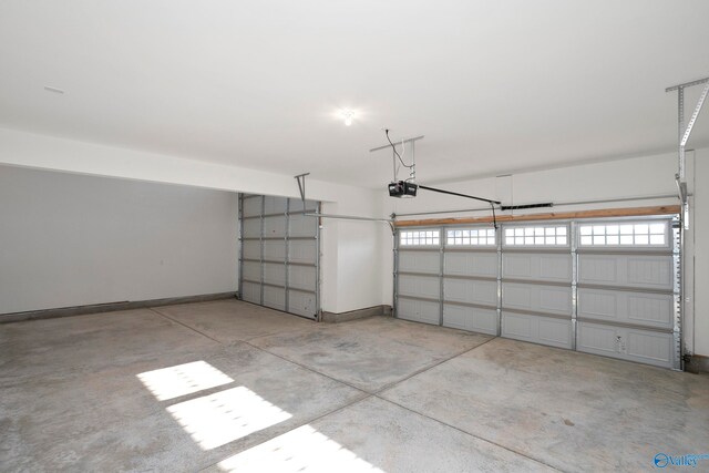 garage featuring baseboards and a garage door opener