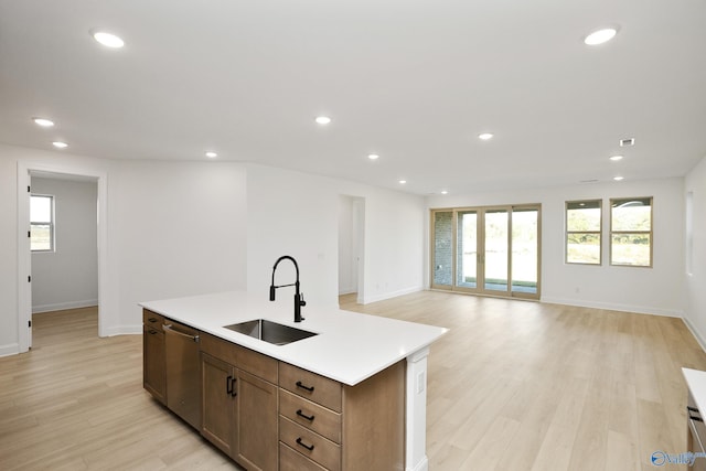 kitchen featuring a sink, stainless steel dishwasher, a wealth of natural light, and recessed lighting