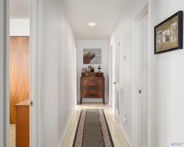 corridor featuring light tile patterned floors