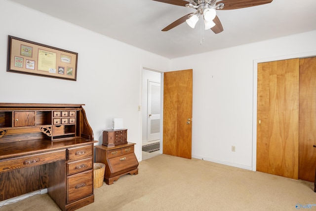 office with carpet flooring and ceiling fan