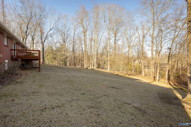 view of yard with a wooden deck