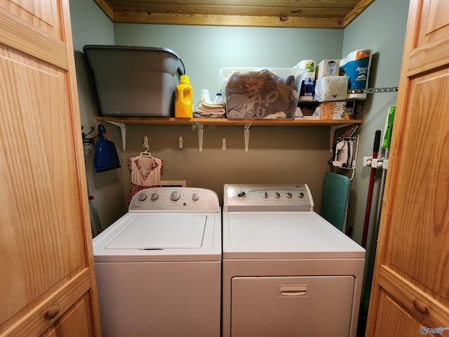 clothes washing area featuring washer and clothes dryer