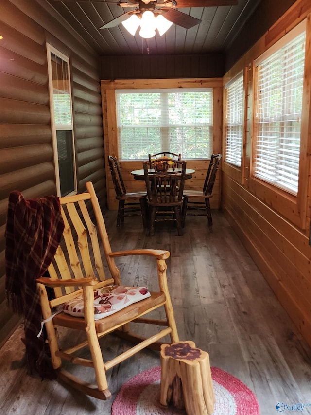 sunroom / solarium with ceiling fan and wooden ceiling