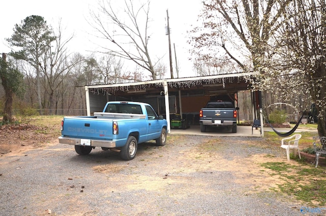 view of vehicle parking with dirt driveway