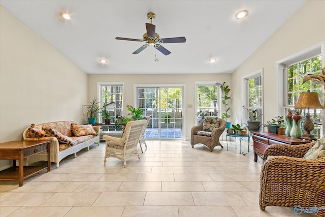 interior space with lofted ceiling and ceiling fan