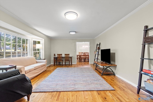 living room featuring ornamental molding and wood finished floors