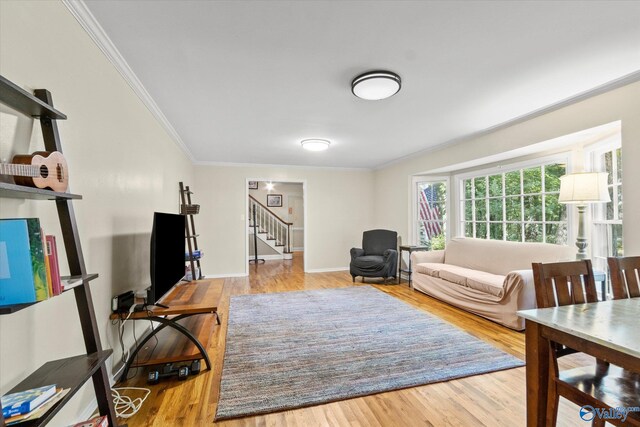 living room with a textured ceiling, a stone fireplace, french doors, hardwood / wood-style flooring, and ceiling fan