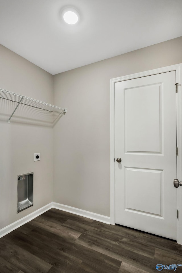 clothes washing area featuring laundry area, dark wood-style floors, baseboards, and hookup for an electric dryer