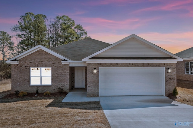 single story home with brick siding, an attached garage, concrete driveway, and a shingled roof