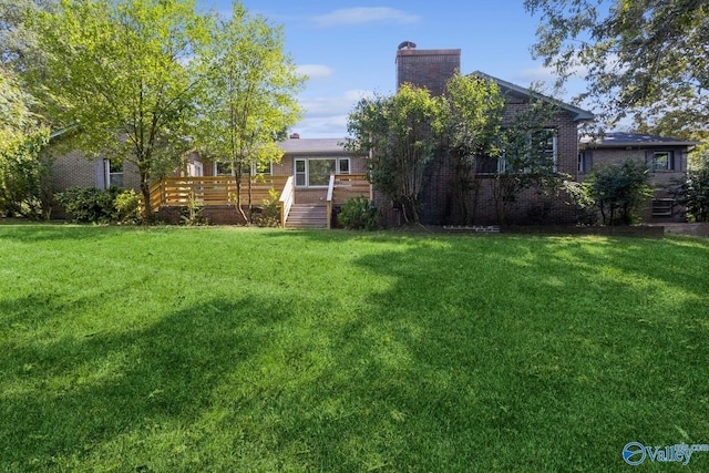 view of yard featuring a wooden deck