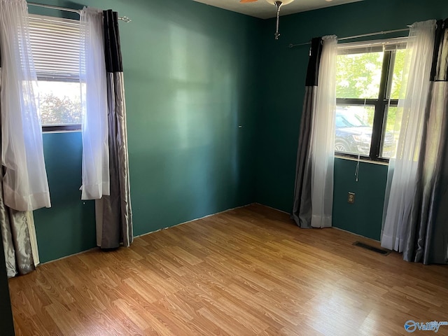 136 Atnip Dr, Scottsboro, AL 35769 - empty room with light wood finished floors and a ceiling fan