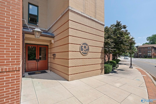 301 NE Holmes Ave Unit 404, Huntsville, AL 35801 - entrance to property with french doors and brick siding