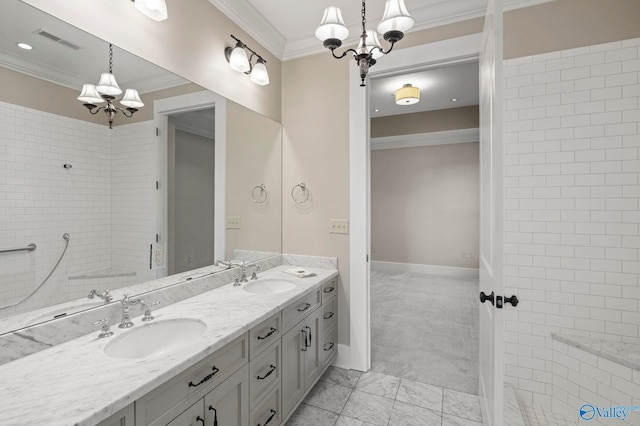 301 NE Holmes Ave Unit 404, Huntsville, AL 35801 - bathroom featuring a chandelier, ornamental molding, double vanity, marble look tile flooring, and recessed lighting