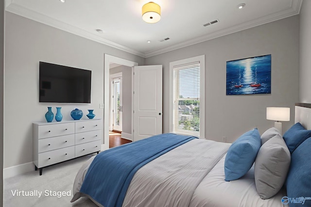 301 NE Holmes Ave Unit 404, Huntsville, AL 35801 - bedroom featuring crown molding, recessed lighting, and light colored carpet