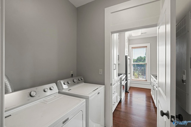301 NE Holmes Ave Unit 404, Huntsville, AL 35801 - laundry room with separate washer and dryer and dark wood-type flooring