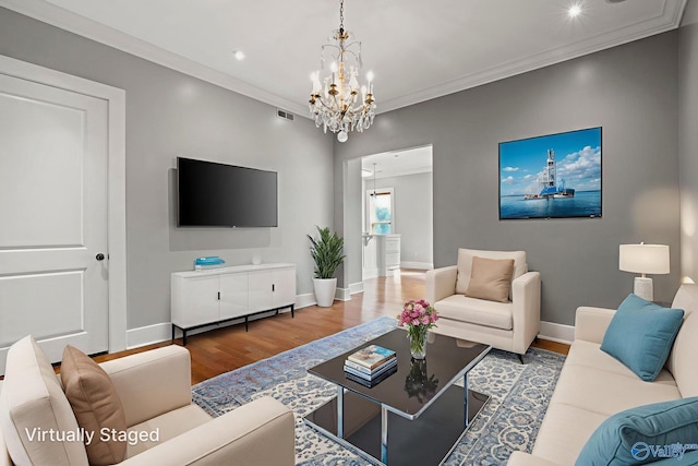 301 NE Holmes Ave Unit 404, Huntsville, AL 35801 - living area with wood finished floors, a chandelier, ornamental molding, and recessed lighting