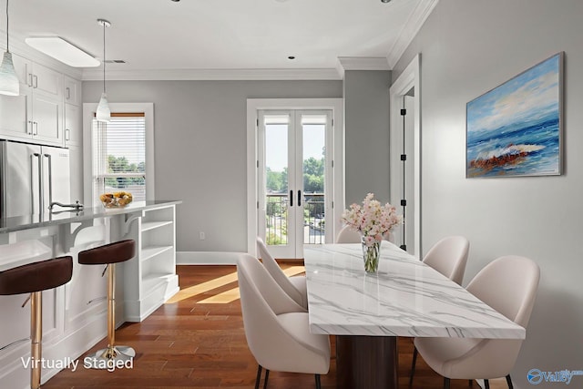 301 NE Holmes Ave Unit 404, Huntsville, AL 35801 - dining area featuring dark wood-style flooring, crown molding, and french doors