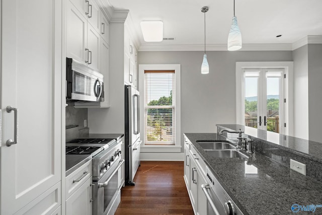 301 NE Holmes Ave Unit 404, Huntsville, AL 35801 - kitchen with appliances with stainless steel finishes, dark wood-type flooring, dark stone counters, french doors, and white cabinetry