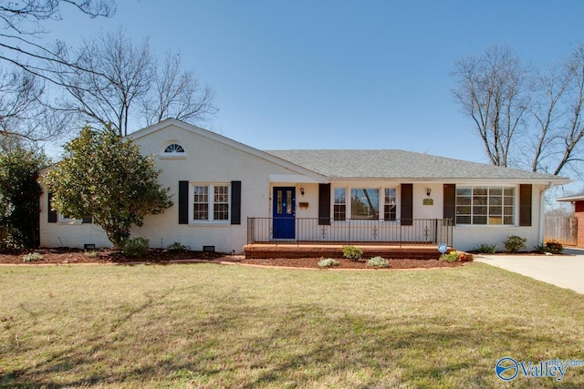 ranch-style home featuring brick siding, a porch, and a front yard