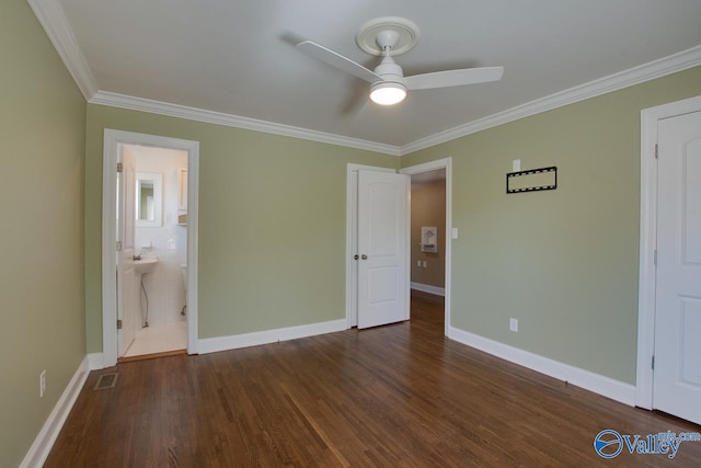 unfurnished bedroom featuring visible vents, crown molding, dark wood-type flooring, baseboards, and a ceiling fan