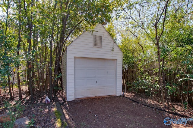 detached garage featuring driveway