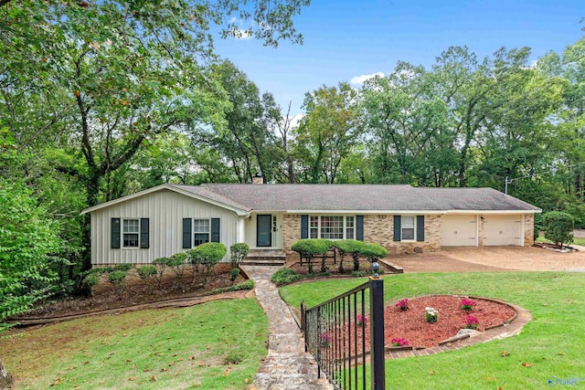 ranch-style home featuring an attached garage, a chimney, driveway, and a front lawn