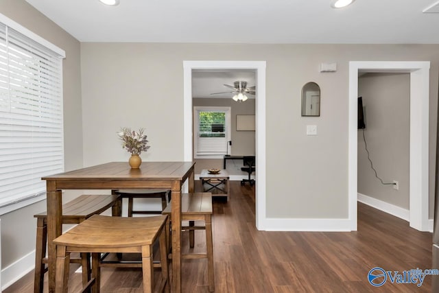 dining space featuring dark hardwood / wood-style flooring and ceiling fan