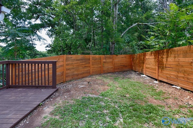 view of yard with a wooden deck