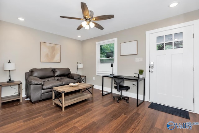 living room with ceiling fan and dark hardwood / wood-style floors